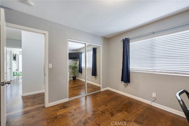 812 N Fern St, Orange, CA 92867 - unfurnished bedroom with baseboards, a closet, and wood finished floors