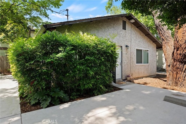 1001 Salem St, Chico, CA 95928 - view of home's exterior with stucco siding and a patio area