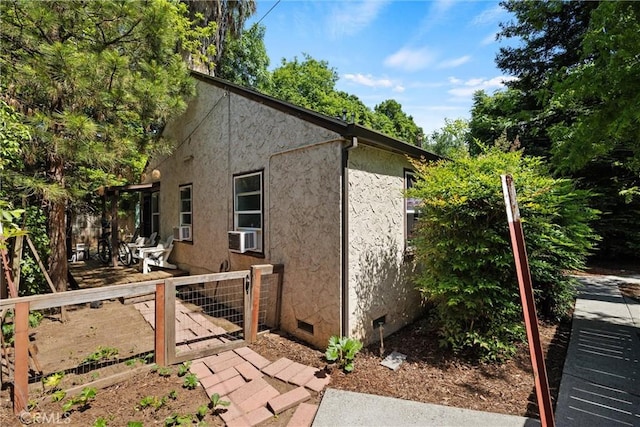 1001 Salem St, Chico, CA 95928 - view of side of home featuring crawl space, a gate, stucco siding, fence, and cooling unit