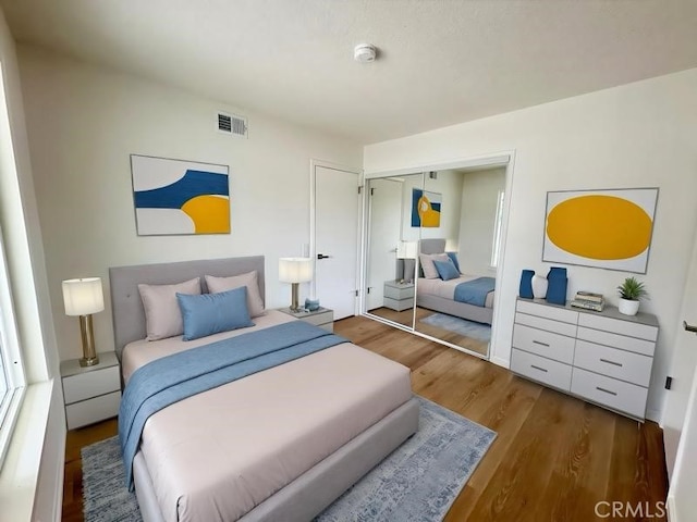 12406 Benson Ave, Chino, CA 91710 - bedroom featuring wood finished floors and a closet