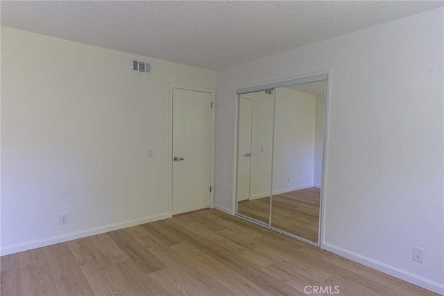 12406 Benson Ave, Chino, CA 91710 - unfurnished bedroom featuring light wood finished floors, a closet, and baseboards