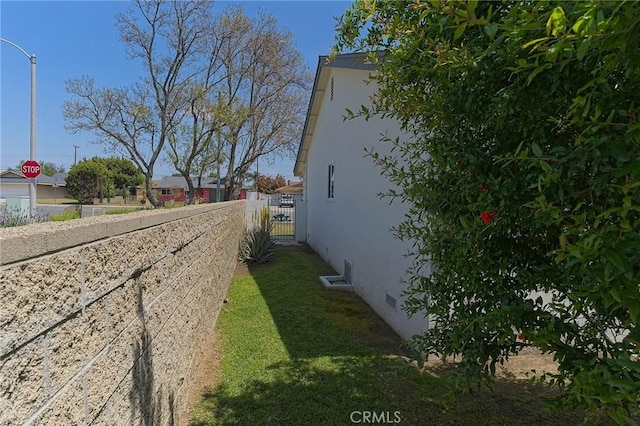 12406 Benson Ave, Chino, CA 91710 - view of home's exterior featuring stucco siding, a gate, and fence