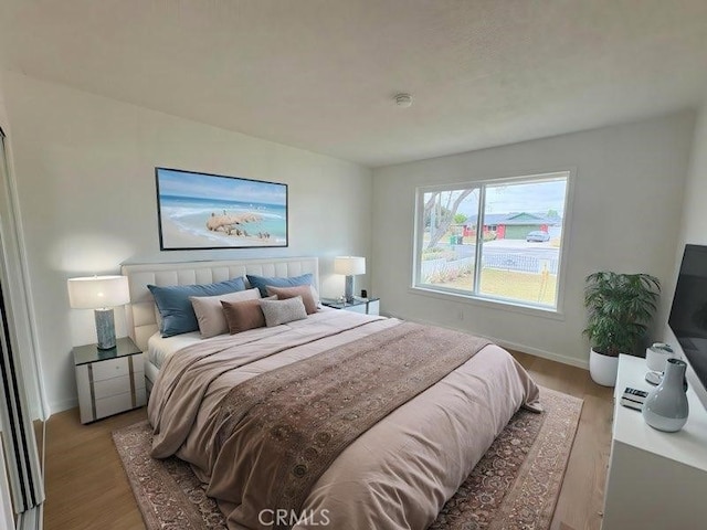 12406 Benson Ave, Chino, CA 91710 - bedroom with light wood-style floors and baseboards