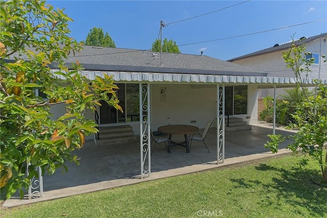 12406 Benson Ave, Chino, CA 91710 - rear view of house featuring entry steps, a patio area, roof with shingles, and stucco siding
