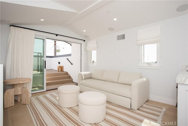 living room featuring light wood finished floors, stairway, baseboards, and recessed lighting