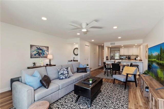 280 S Avenida Caballeros Unit 266, Palm Springs, CA 92262 - living room featuring light wood-type flooring, ceiling fan, baseboards, and recessed lighting