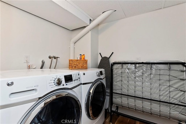 280 S Avenida Caballeros Unit 266, Palm Springs, CA 92262 - washroom with washer and dryer and wood finished floors