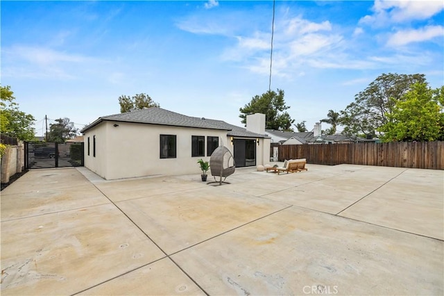 6838 Belmar Ave, Reseda, CA 91335 - back of house with stucco siding, a patio, and a fenced backyard
