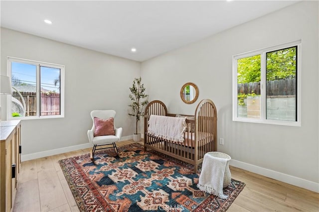 6838 Belmar Ave, Reseda, CA 91335 - bedroom featuring light wood-type flooring, a nursery area, baseboards, and recessed lighting