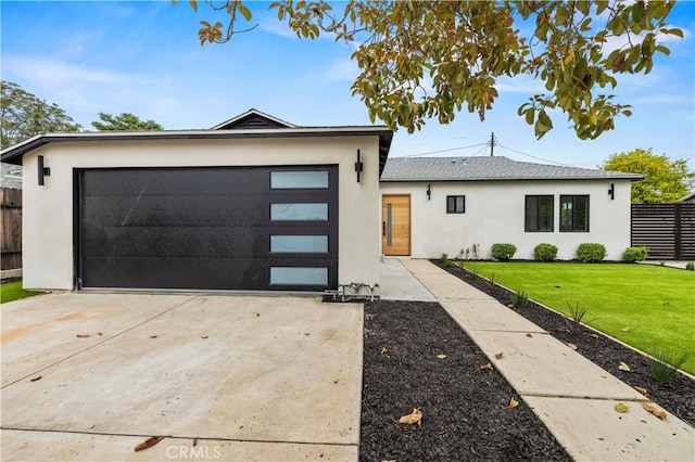 6838 Belmar Ave, Reseda, CA 91335 - view of front facade with stucco siding, concrete driveway, and an attached garage