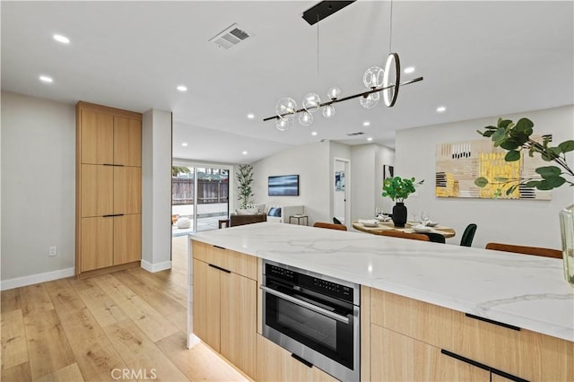 6838 Belmar Ave, Reseda, CA 91335 - kitchen featuring oven, light brown cabinetry, modern cabinets, and recessed lighting