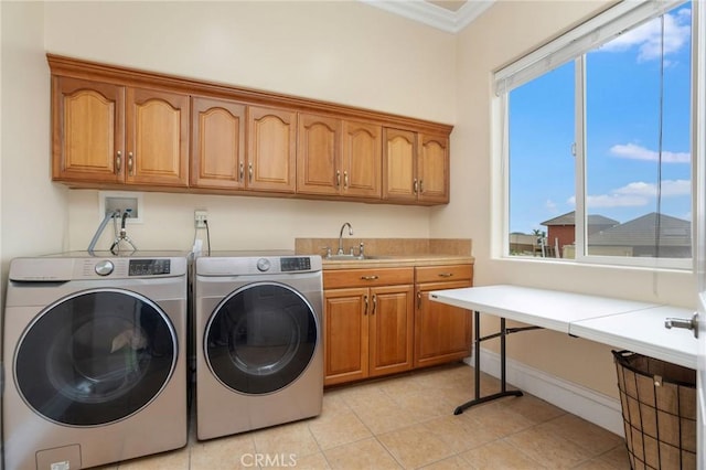 12336 Circula Panorama, North Tustin, CA 92705 - laundry room with washer and clothes dryer, cabinet space, crown molding, and light tile patterned flooring