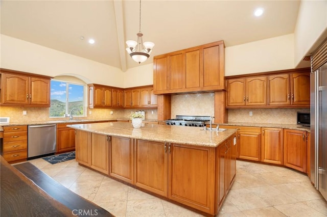 12336 Circula Panorama, North Tustin, CA 92705 - kitchen featuring stainless steel appliances, a kitchen island, brown cabinetry, light stone countertops, and high vaulted ceiling