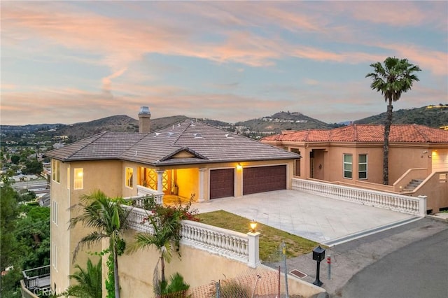 12336 Circula Panorama, North Tustin, CA 92705 - view of front of home with a garage, a fenced front yard, driveway, stucco siding, and a tiled roof