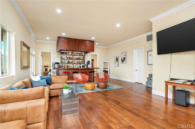 12336 Circula Panorama, North Tustin, CA 92705 - living area featuring wood finished floors, crown molding, a bar, and recessed lighting