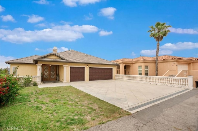 12336 Circula Panorama, North Tustin, CA 92705 - view of front of property with a garage, concrete driveway, stucco siding, a tile roof, and a chimney