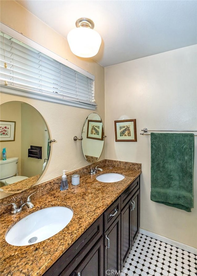 1803 Blue Haven Dr, Rowland Heights, CA 91748 - full bath with toilet, double vanity, and baseboards