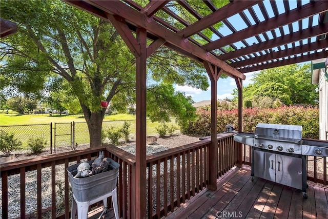 deck with a pergola, a fenced backyard, and area for grilling