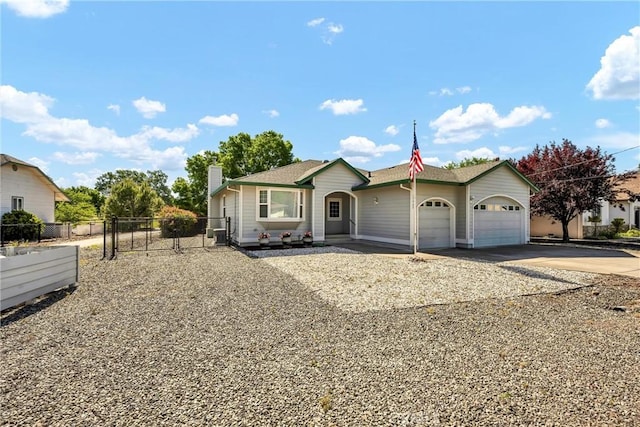 ranch-style house featuring driveway, a garage, a chimney, fence, and a gate