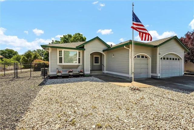 view of front of house featuring a garage, fence, driveway, and cooling unit