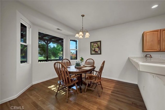 dining area featuring baseboards, dark wood-style flooring, a chandelier, and recessed lighting