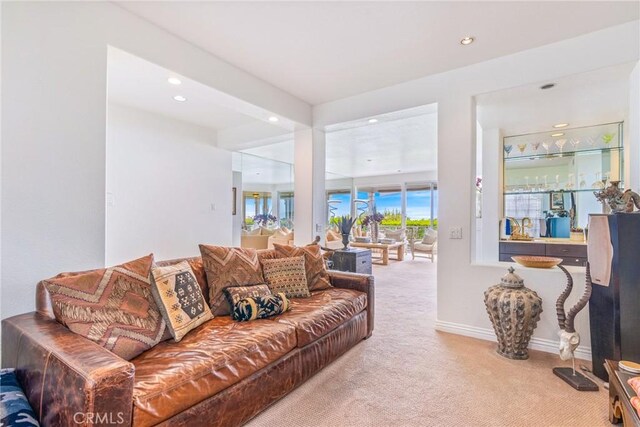 living room featuring carpet floors, recessed lighting, and baseboards
