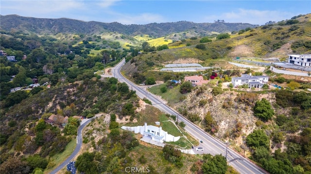 aerial view of property's location with a mountainous background