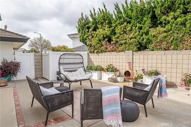 20011 Colgate Cir, Huntington Beach, CA 92646 - fenced backyard with outdoor lounge area and a patio area