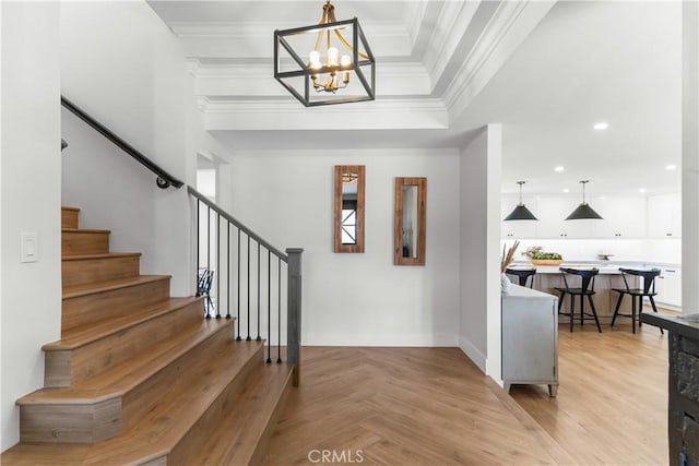 20011 Colgate Cir, Huntington Beach, CA 92646 - foyer with stairs, a chandelier, crown molding, baseboards, and recessed lighting