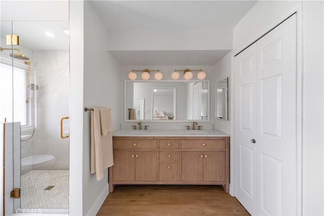 20011 Colgate Cir, Huntington Beach, CA 92646 - full bathroom with double vanity, a stall shower, wood finished floors, and baseboards