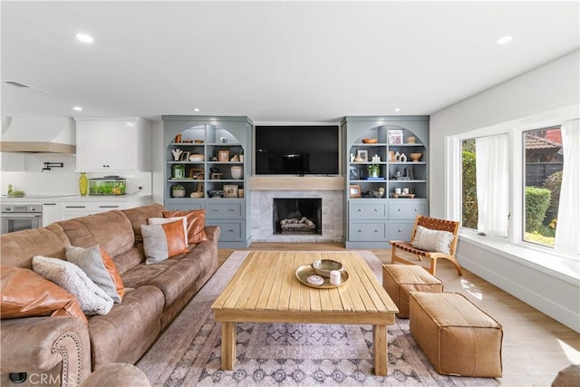 20011 Colgate Cir, Huntington Beach, CA 92646 - living area with light wood finished floors, a fireplace, and recessed lighting