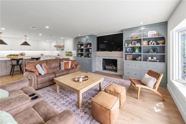 20011 Colgate Cir, Huntington Beach, CA 92646 - living area featuring light wood finished floors, a fireplace, and recessed lighting