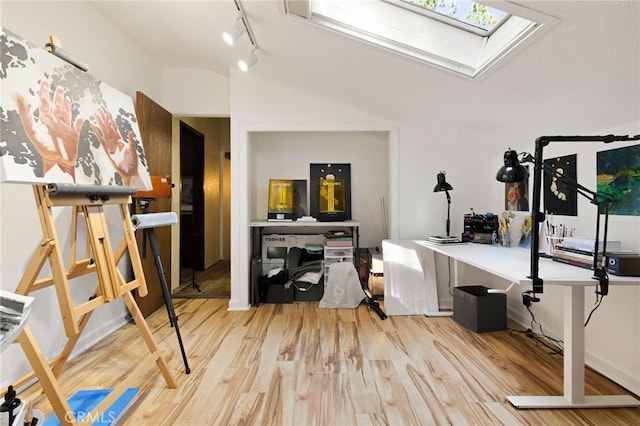 14315 Troy Way, Magalia, CA 95954 - workout area featuring a skylight, wood finished floors, and track lighting