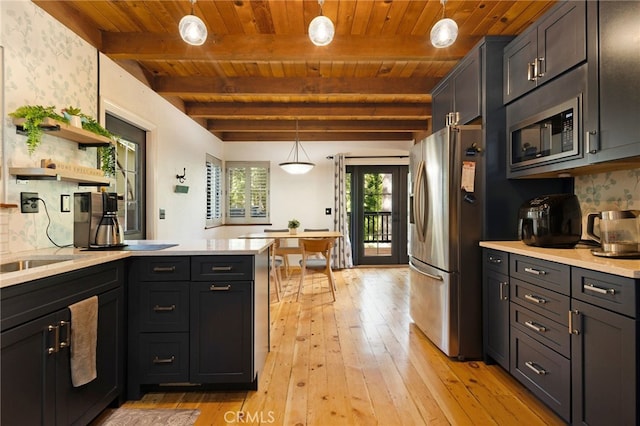 14315 Troy Way, Magalia, CA 95954 - kitchen with appliances with stainless steel finishes, wooden ceiling, light countertops, light wood-type flooring, and tasteful backsplash