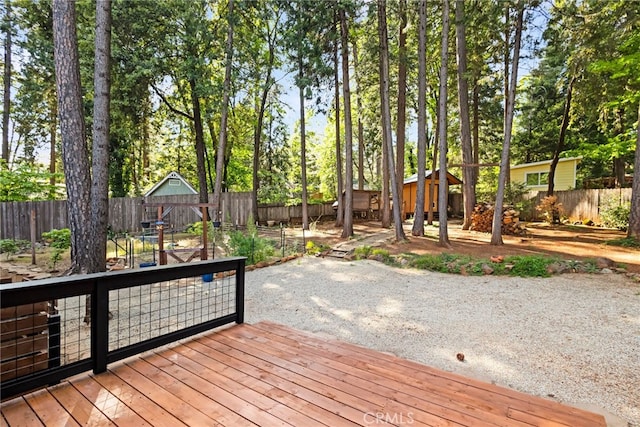 14315 Troy Way, Magalia, CA 95954 - deck with a fenced backyard, an outbuilding, and a storage shed