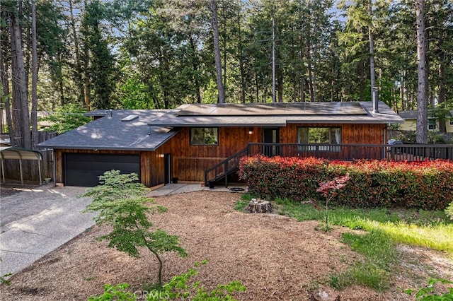 14315 Troy Way, Magalia, CA 95954 - view of front of property featuring driveway, solar panels, and a shingled roof