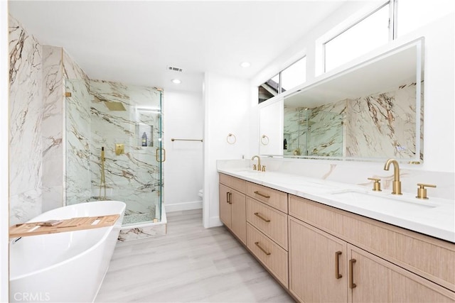 12029 Bubbling Brook St, Moorpark, CA 93021 - full bathroom featuring a marble finish shower, double vanity, a freestanding bath, toilet, and recessed lighting