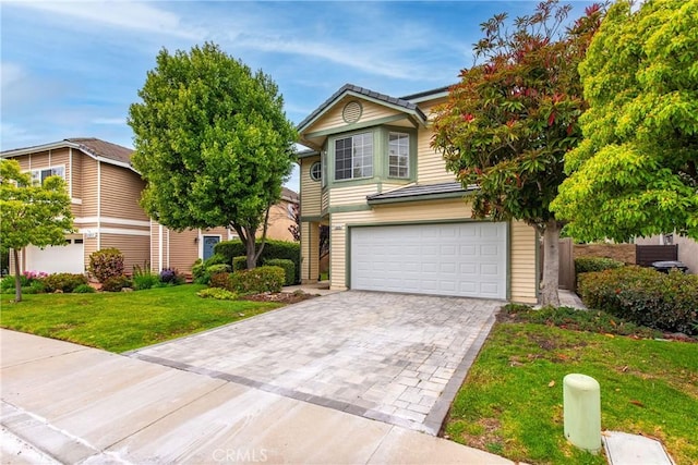 12029 Bubbling Brook St, Moorpark, CA 93021 - view of front of home with a garage, a front lawn, and decorative driveway