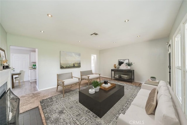 3465 Sepulveda Ave, San Bernardino, CA 92404 - living area with baseboards, a fireplace, and recessed lighting