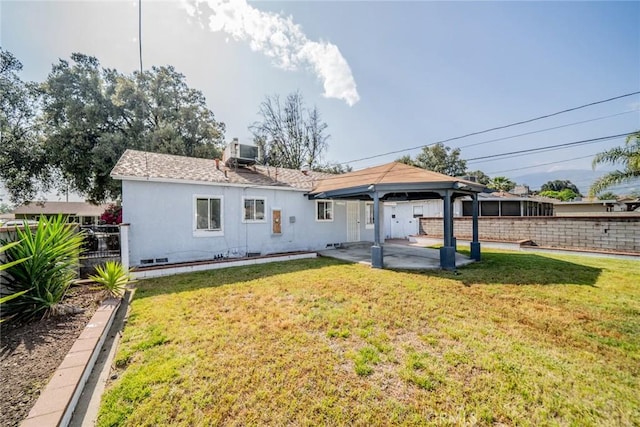 3465 Sepulveda Ave, San Bernardino, CA 92404 - rear view of house featuring central air condition unit, a patio, and a gazebo