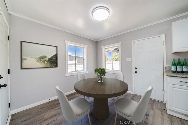 3465 Sepulveda Ave, San Bernardino, CA 92404 - dining area with wood finished floors, ornamental molding, and baseboards