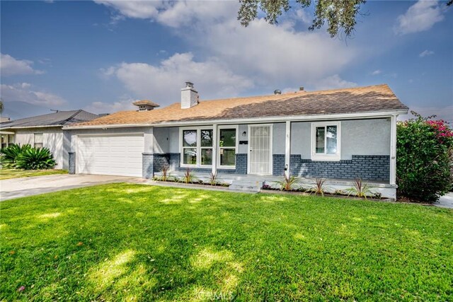 3465 Sepulveda Ave, San Bernardino, CA 92404 - single story home featuring brick siding, a garage, a front yard, driveway, and stucco siding