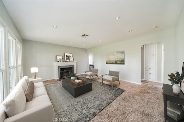 3465 Sepulveda Ave, San Bernardino, CA 92404 - carpeted living room with a tile fireplace, baseboards, and recessed lighting