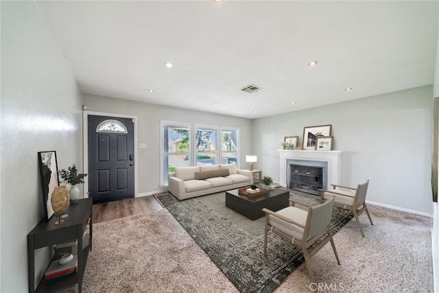 3465 Sepulveda Ave, San Bernardino, CA 92404 - living room with a tile fireplace, baseboards, wood finished floors, and recessed lighting