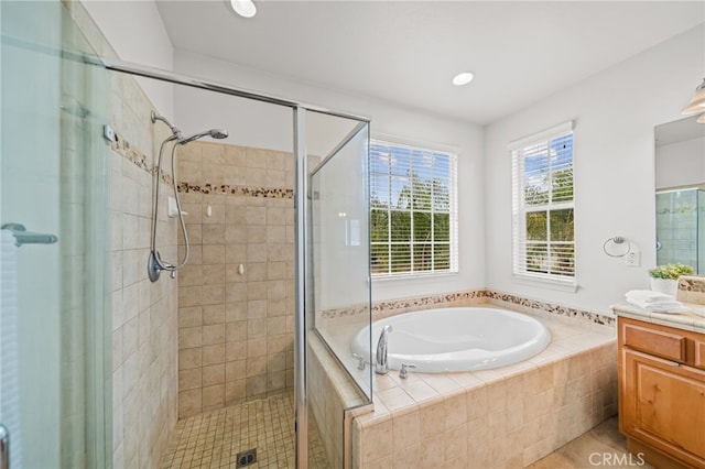 bathroom featuring a shower stall, a bath, vanity, and tile patterned floors