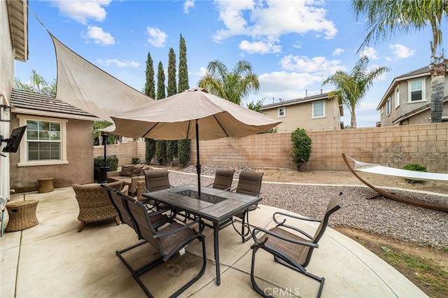 view of patio / terrace with a fenced backyard and outdoor dining space