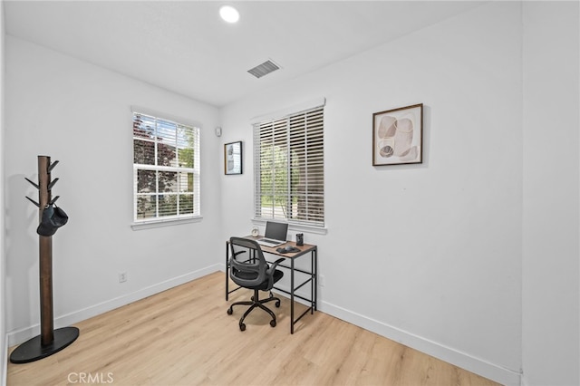 office space with wood finished floors, baseboards, and recessed lighting