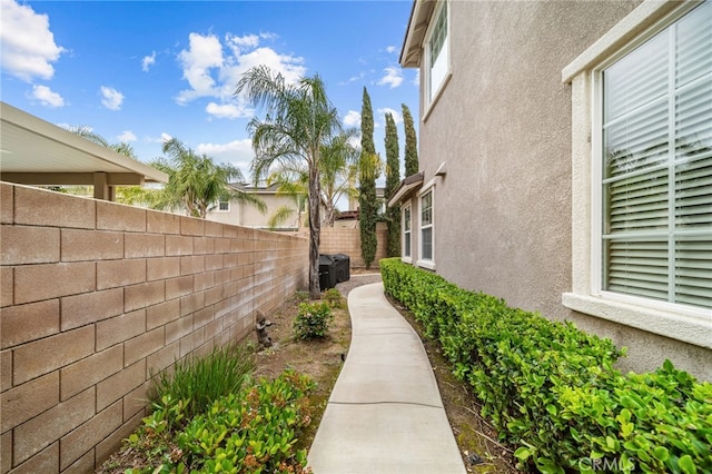 view of home's exterior with a fenced backyard and stucco siding
