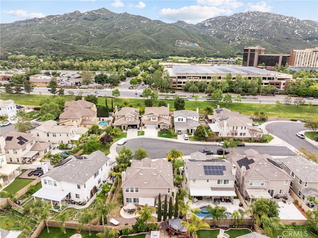 aerial perspective of suburban area featuring a mountain backdrop