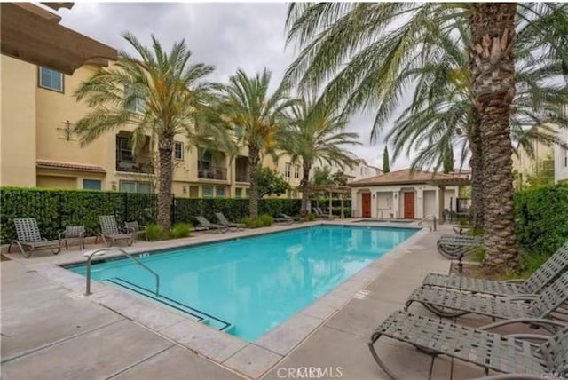 12440 Constellation St, Eastvale, CA 91752 - community pool with a patio and fence